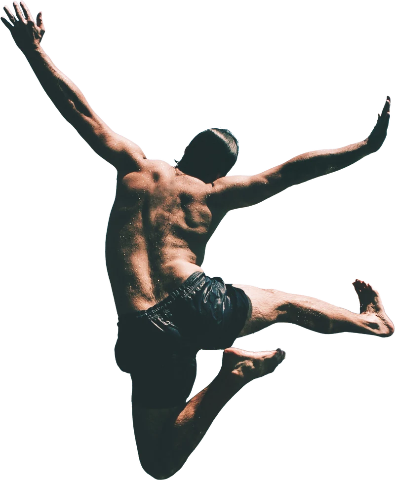 Man leaping above a mountain lake